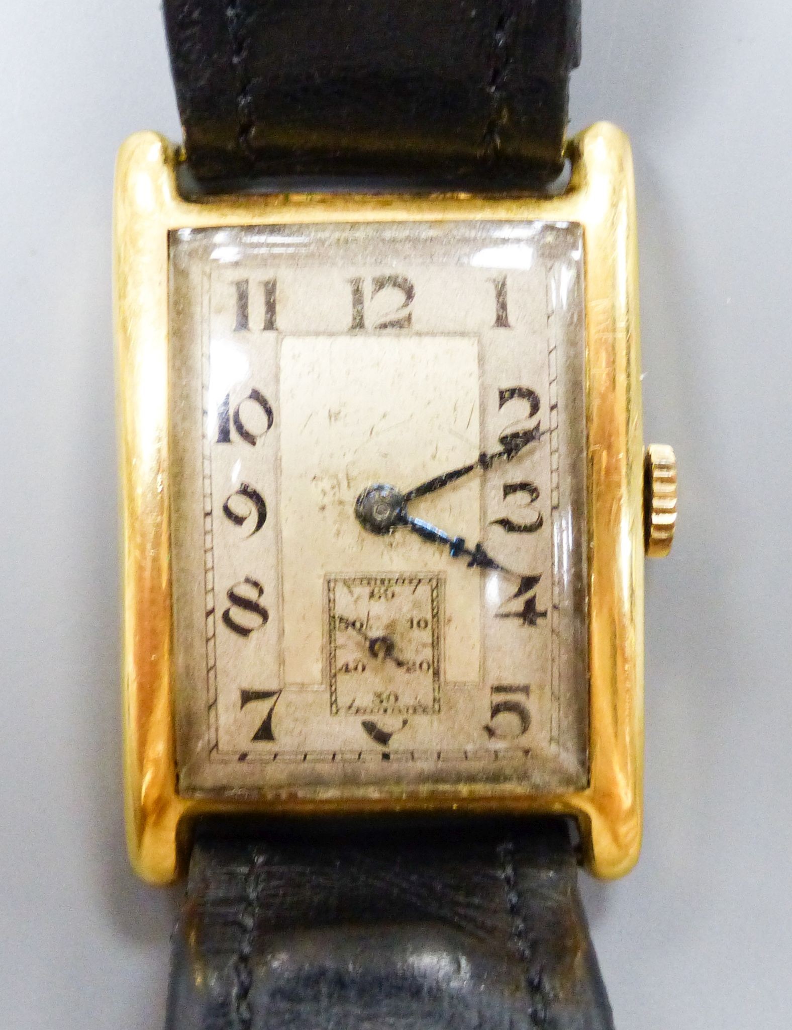 A gentleman's 1930's 18ct gold Aster manual wind rectangular dial wrist watch, on a leather strap, cased diameter 24mm, gross weight 27.7 grams.